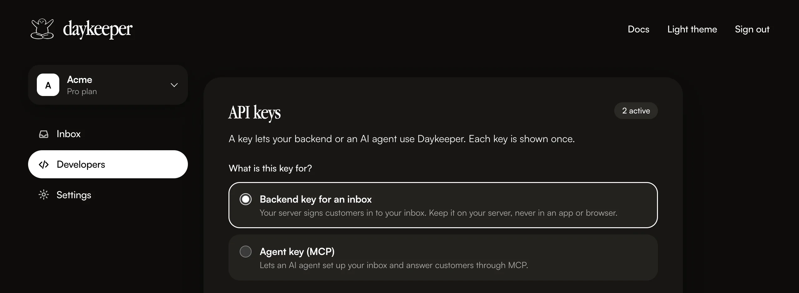 The Developers page of the Daykeeper console in dark mode: API keys, 2 active, with a choice between a backend key for an inbox and an agent key for MCP.